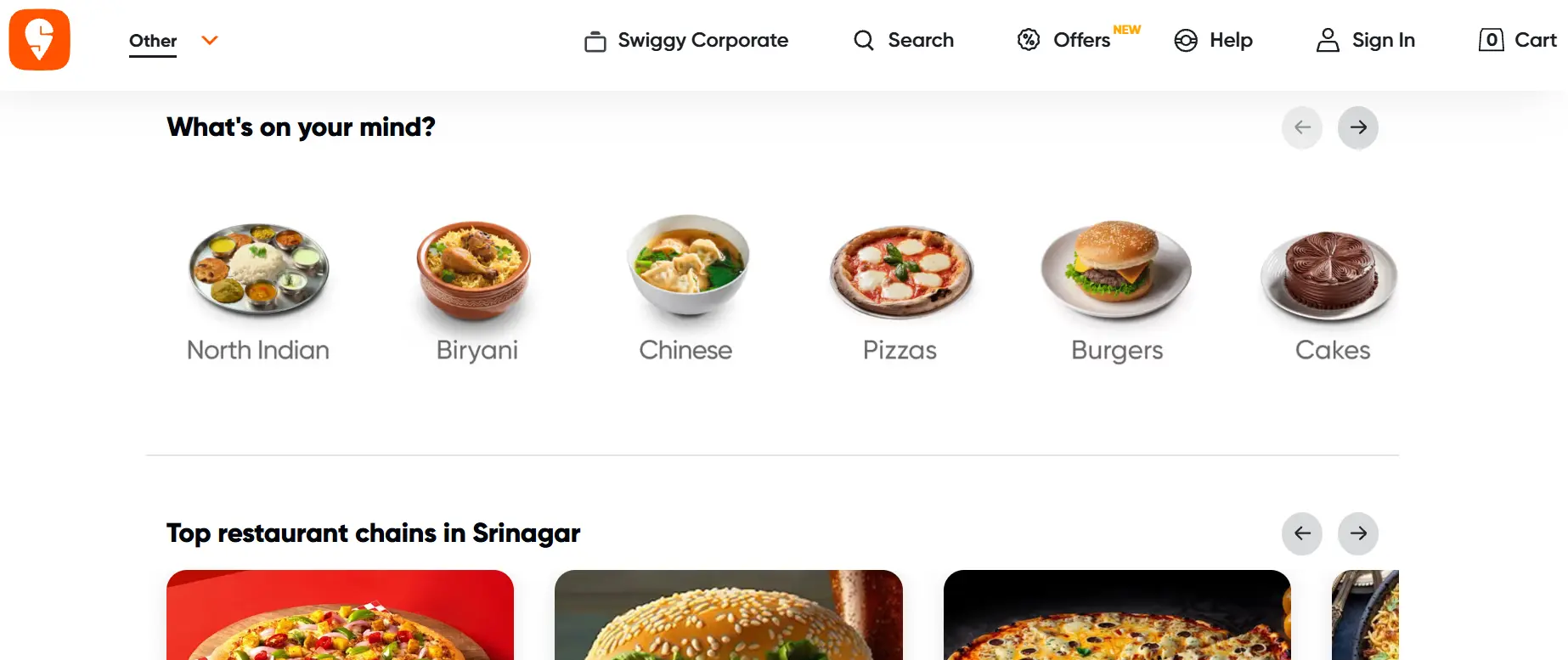 Screenshot of the Swiggy app homepage displaying food categories such as North Indian, Biryani, Chinese, Pizza, Burgers, and Cakes, along with featured restaurant chains and online food ordering options.