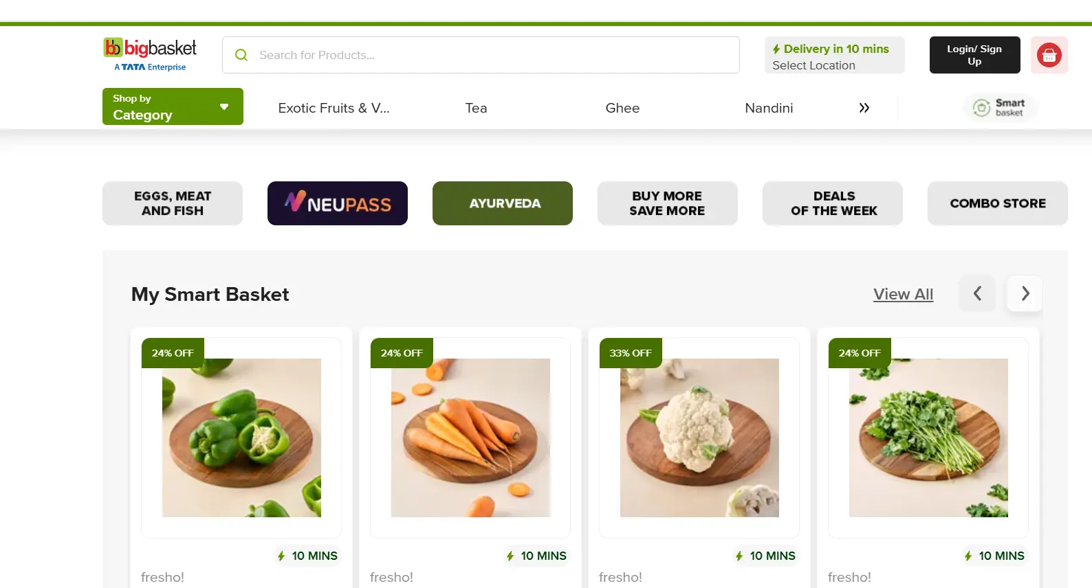 Screenshot of the BigBasket quick commerce platform showing a product search bar, grocery categories, promotional offers, and fresh vegetables available for delivery within 10 minutes.
